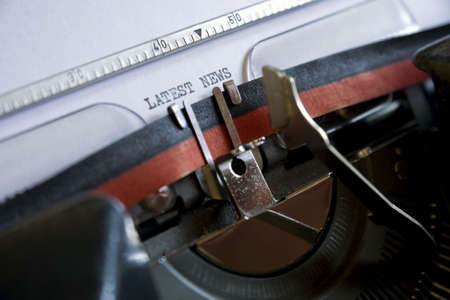 Latest news written on a vintage typewriterの写真素材