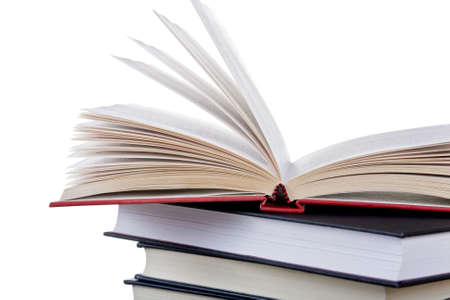Stack of books with one left openの写真素材