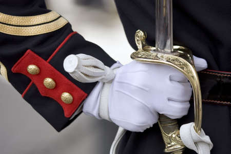 Military honour guard holding his sword presenting armsの写真素材