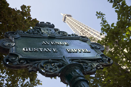 Eiffel Tower with street sign in forgroundの写真素材