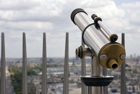 Telescope at travel destination overlooking the cityの写真素材