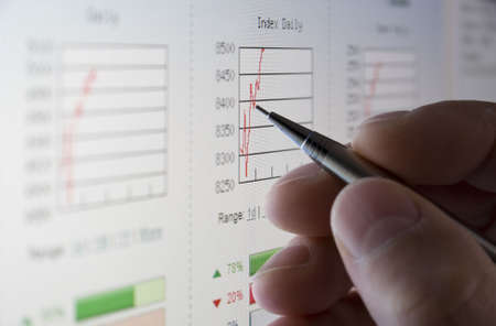 Businessman analysing share prices on the stock marketの写真素材