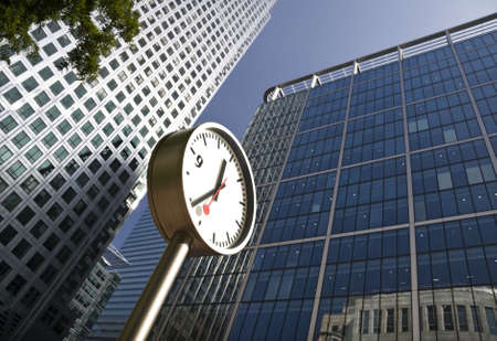Clock at Canary Wharf in London Docklands financial districtの写真素材