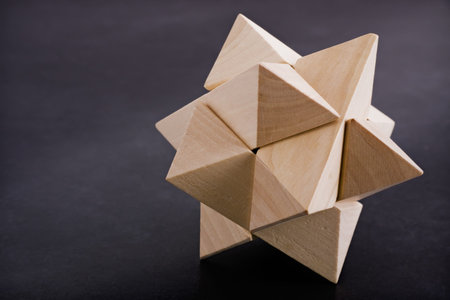 Complex wooden puzzle with dark space for copy