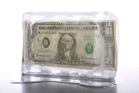 Business concept for frozen assets - One US dollar note in iceの写真素材