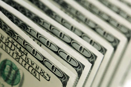 US paper currency one hundred dollar bills in a rowの写真素材