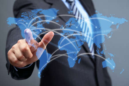 Global communications network, businessman with futuristic world map concept for business and social networking mediaの写真素材