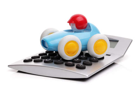 Toy car and calculator concept for buying, renting, fuel or service and repair costsの写真素材