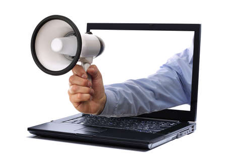 Megaphone through a laptop computer monitorの写真素材