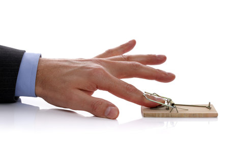 Caught in a mousetrap concept for temptation, corporate crime or accident
