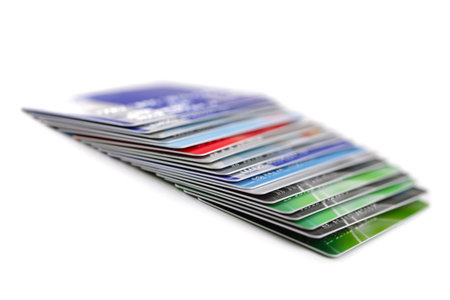 Stack of plastic credit cards, isolated on white 