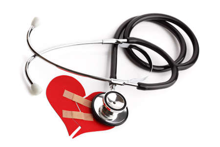 Stethoscope and broken heart concept for heart disease or illnessの写真素材