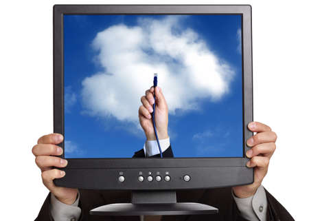 Concept for cloud computing -  busnessman holding a laptop screen showing a hand connecting to the cloud with ethernet cableの写真素材