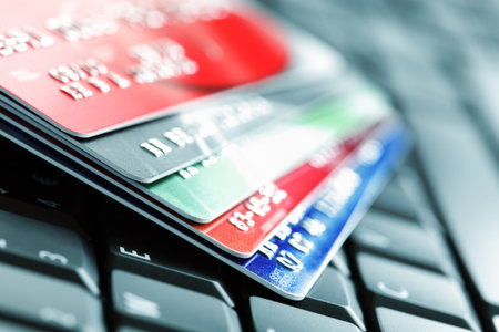 Five credit cards on a computer keyboard concept for e-commerce