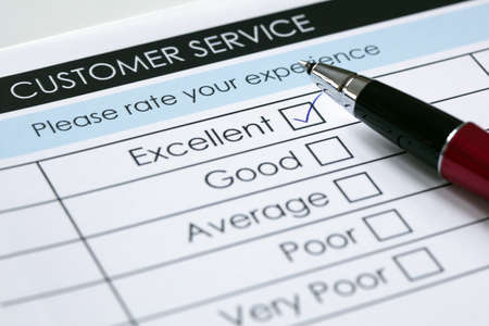 Tick placed in excellent checkbox on customer service satisfaction survey formの写真素材