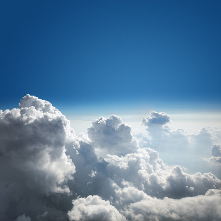 Blue sky and cloud background from above the clouds