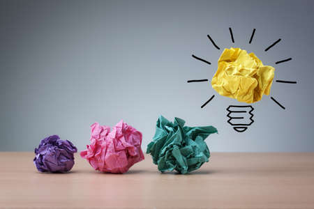 Inspiration concept crumpled paper light bulb metaphor for good ideaの写真素材