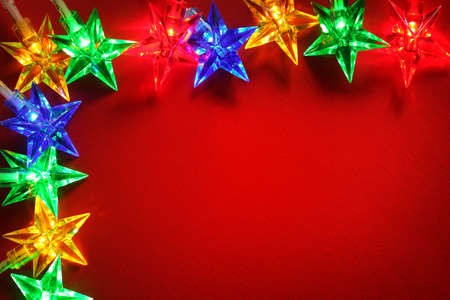 Christmas lights red background with copy spaceの写真素材