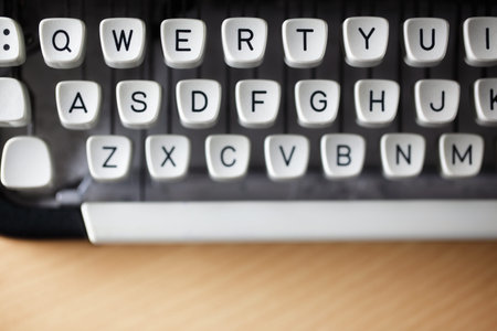 Typewriter qwerty keys on wooden desk