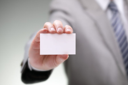 Businessman showing his business card
