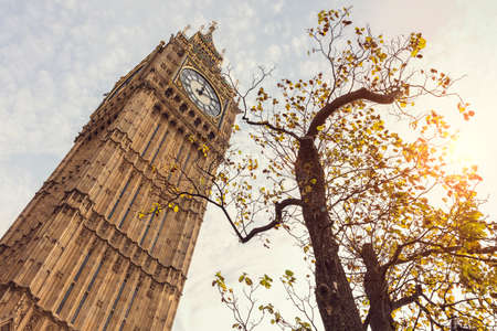 Big Ben in London UK low angle in autumn sunshineの写真素材