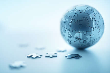Global strategy solution concept - earth jigsaw puzzleの写真素材