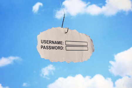 Computer username login and password on paper attached to a hook concept for phishing or internet securityの写真素材