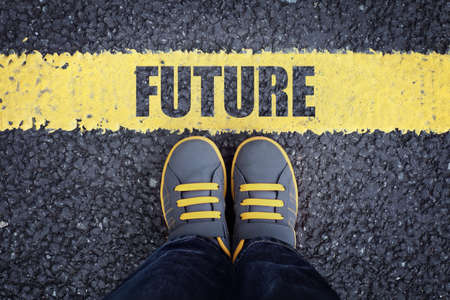 Future line child in sneakers standing next to a yellow lineの写真素材