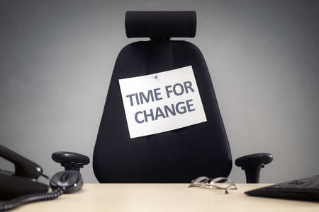 Time for change empty business chair with sign in office concept for motivation, opportunity, and progressの写真素材
