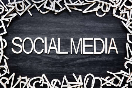 Social Media wooden letters on black boardの写真素材