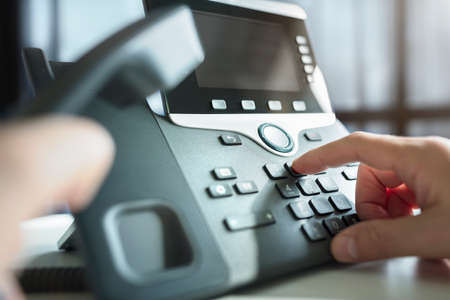 Dialing telephone keypad concept for communication, contact us and customer service supportの写真素材