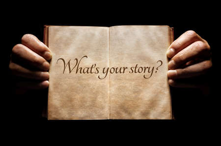What's your story? hands holding an open book background messageの写真素材