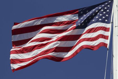 US flag fluttering in the windの写真素材
