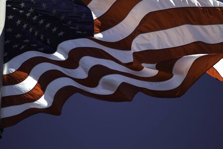 US flag fluttering in the windの写真素材