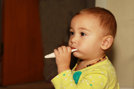 One and Half Year Old Baby Girl Brushing Her Teethの写真素材