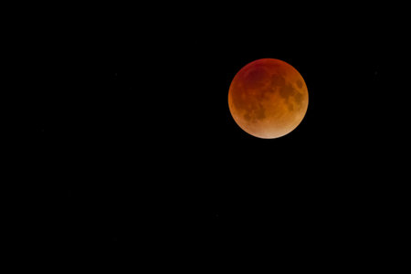 A red supper orange moon in the evening night