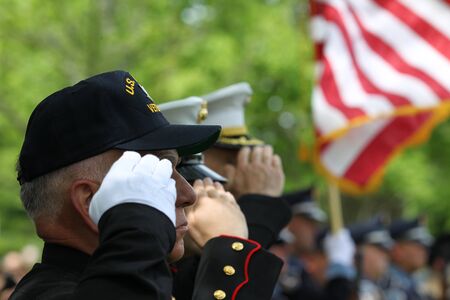 Memorial Day Ceremony hold in Lexington, Massachusetts on May 26,2014. Veteran and Military Officers Saluting at Memorial Day Ceremonyのeditorial素材
