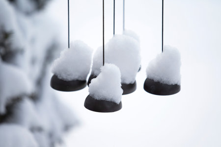 Wind Chimes Covered Snow in Winter, New England, USAの写真素材