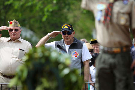 Veterans and Scouts Saluting at Memorial Day Ceremony Held in Lexington, MA on Tuesday, Sunday, May 24, 2015.のeditorial素材