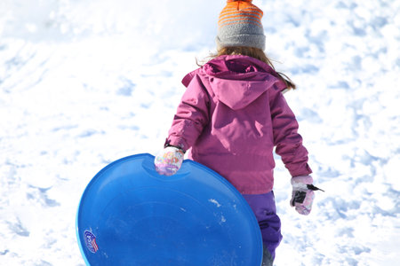 Family, Kids, girls, boys and teenges having a lot of fun in the snow sledding, New England, USのeditorial素材