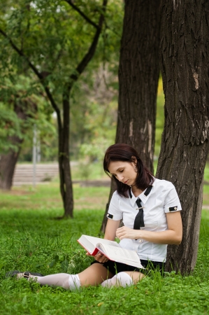 Beautiful student reading the bookの写真素材