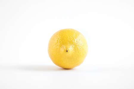 Front view of lemon isolated on white background, yellow healthy fruitの写真素材
