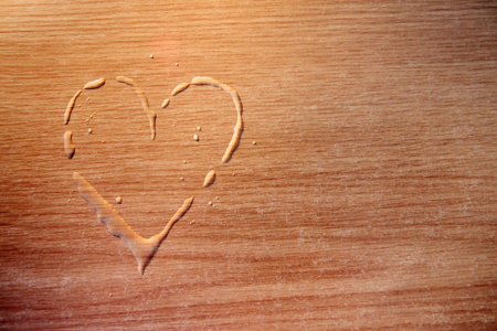 heart drops on a table, love concept on woodenの写真素材