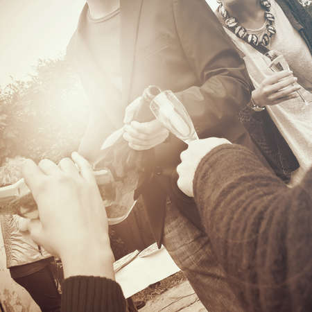 people drinking sparkling wine at a partyの写真素材