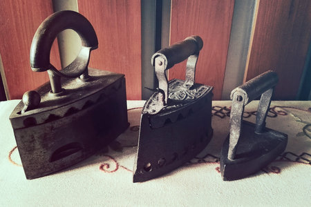 Old irons. Set of three vintage objects from the largest to the smallest