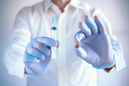Biotech foods. Test on food concept, scientist with blue latex gloves holding a syringe and a bean...