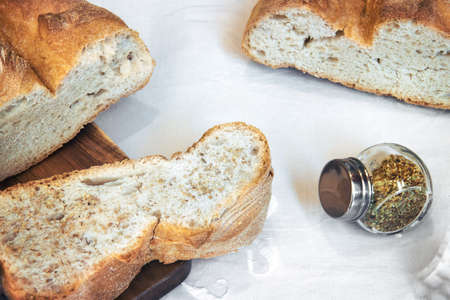bread with oregano, slices of white bread with spicesの写真素材