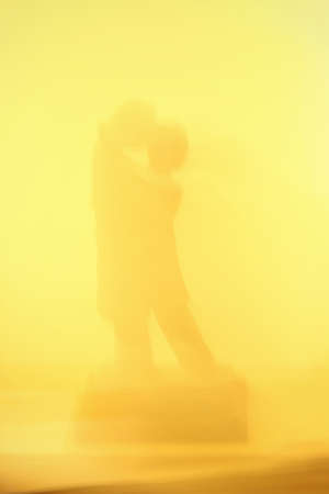 abstract lovers concept, vertical image of blurred couple hugging (intentionally blurry photo)の写真素材