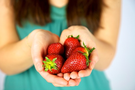 beautiful strawberries in models handsの写真素材