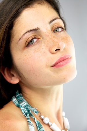 Elegant female model with many freckles and big blue eyesの写真素材